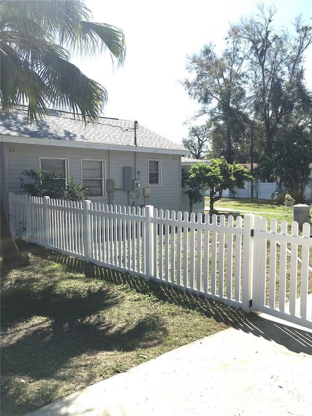 view of gate featuring a fenced front yard