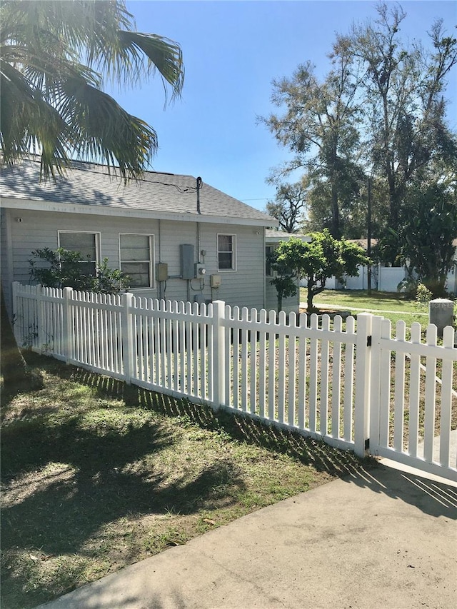 view of side of home with a fenced front yard