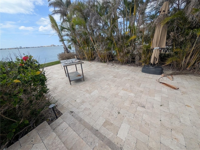 view of patio featuring a water view