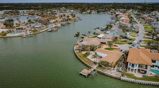 drone / aerial view featuring a residential view and a water view