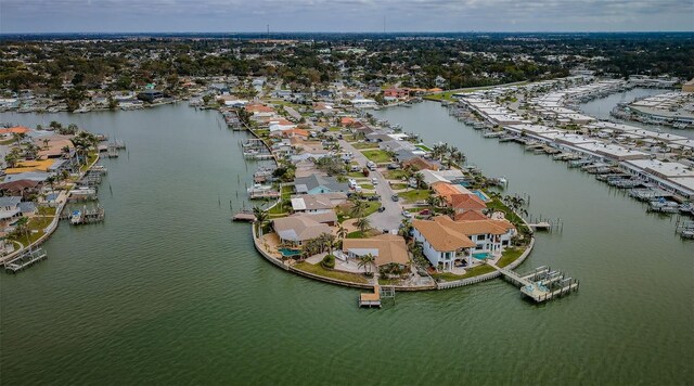 drone / aerial view with a water view and a residential view