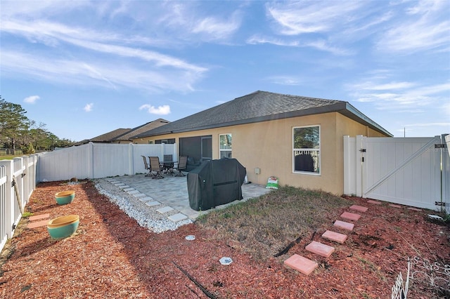 back of house featuring a patio area