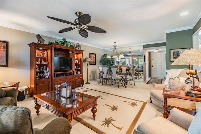 living area featuring a ceiling fan, light carpet, and crown molding