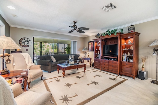 living area with visible vents, crown molding, light carpet, and ceiling fan