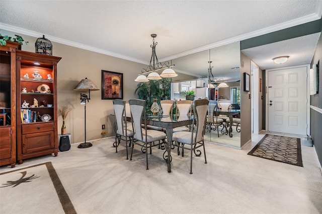 dining area featuring light carpet, ornamental molding, and a textured ceiling