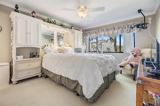 bedroom with light carpet, ceiling fan, and ornamental molding