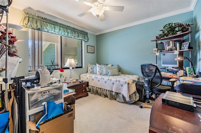 carpeted bedroom featuring a ceiling fan, ornamental molding, and a textured ceiling