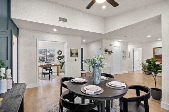 dining space with a ceiling fan, recessed lighting, visible vents, and light wood-style flooring