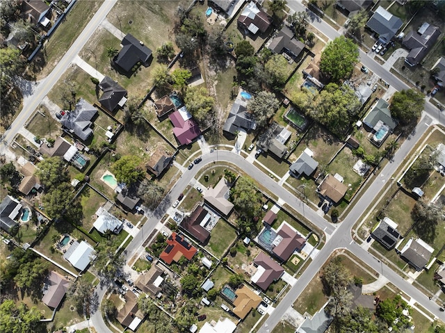 birds eye view of property with a residential view