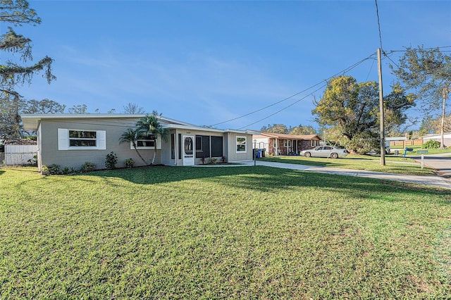 ranch-style house featuring a front lawn