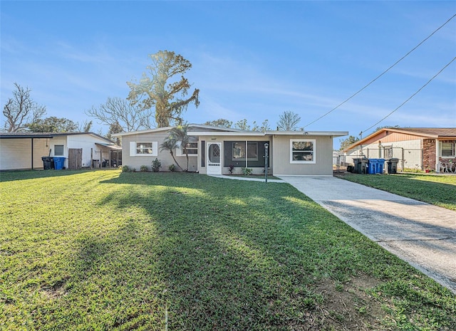 ranch-style house with a front lawn