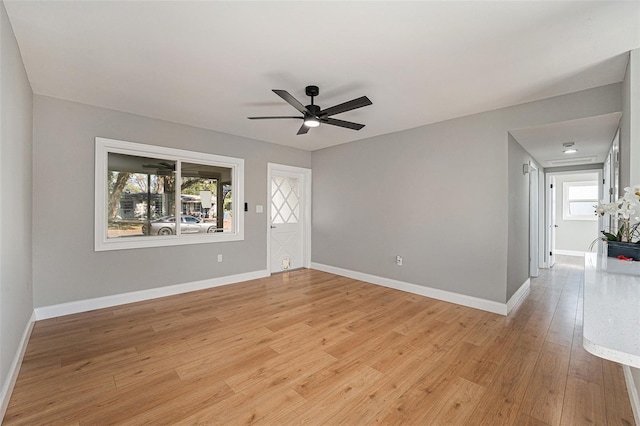 unfurnished room featuring ceiling fan and light hardwood / wood-style floors