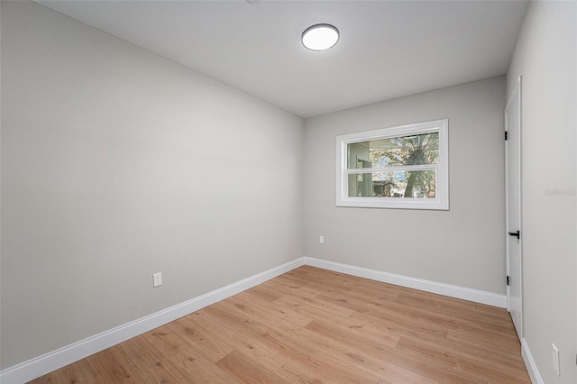 empty room with light hardwood / wood-style flooring