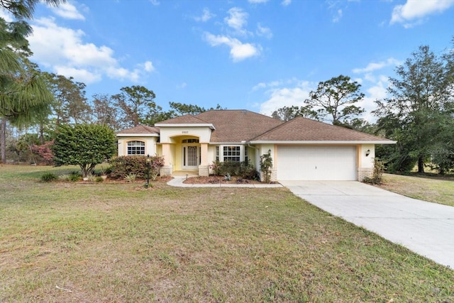 view of front of property featuring a front lawn and a garage