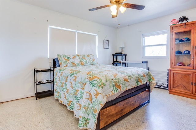 bedroom featuring ceiling fan and speckled floor