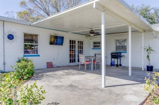 view of patio / terrace with outdoor dining area, ceiling fan, and area for grilling