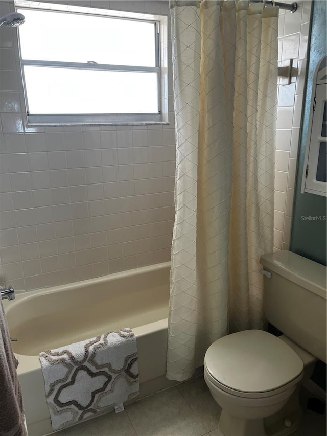 9815 47th Ave N Unit 303, Saint Petersburg, FL 33708 - full bathroom with tile patterned flooring, toilet, and shower / bathtub combination with curtain