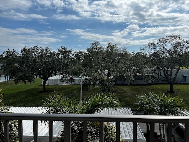 9815 47th Ave N Unit 303, Saint Petersburg, FL 33708 - view of yard with a balcony