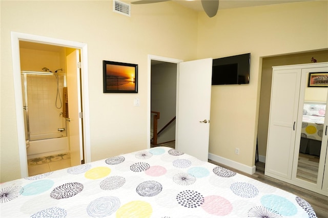 bedroom with ensuite bath and visible vents