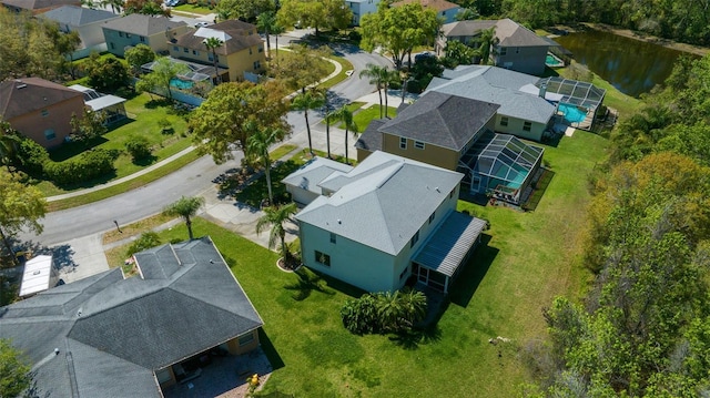 aerial view featuring a residential view and a water view