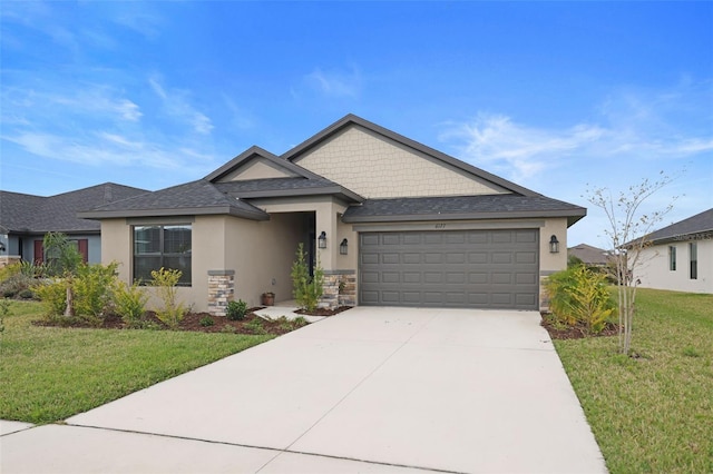 view of front of house with a front lawn, stucco siding, a garage, stone siding, and driveway