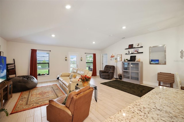 living room with recessed lighting, baseboards, lofted ceiling, and light wood-style floors