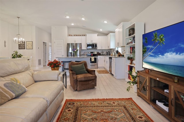 living room with vaulted ceiling, recessed lighting, and a chandelier