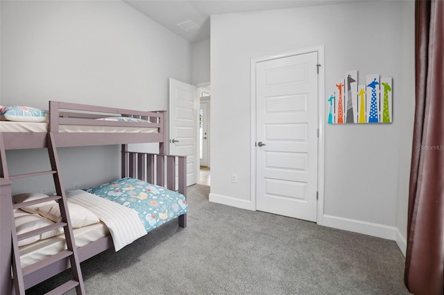 carpeted bedroom featuring baseboards