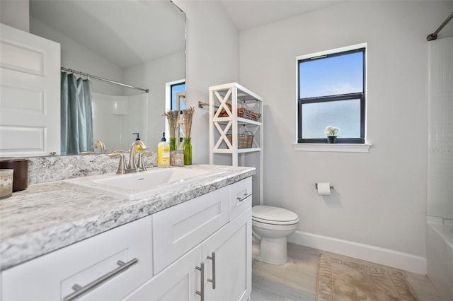 full bathroom featuring vanity, baseboards, lofted ceiling, shower / bath combination with curtain, and toilet