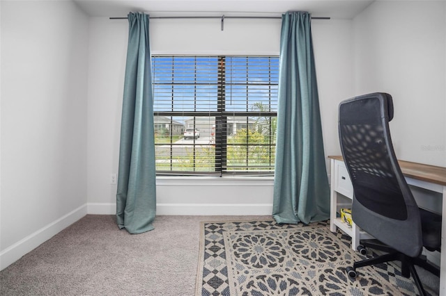 home office with baseboards and carpet