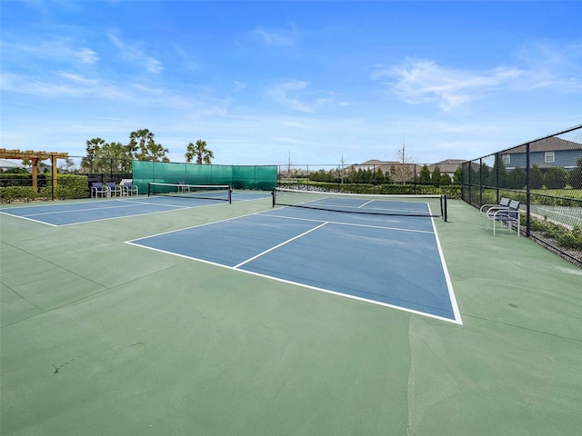 view of sport court with community basketball court and fence