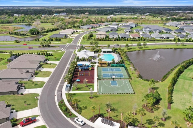 birds eye view of property with a residential view and a water view