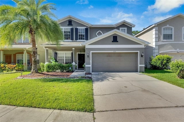 traditional-style house with driveway, a front lawn, and stucco siding