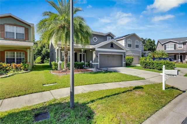 view of front of home featuring stucco siding, a garage, a residential view, driveway, and a front lawn