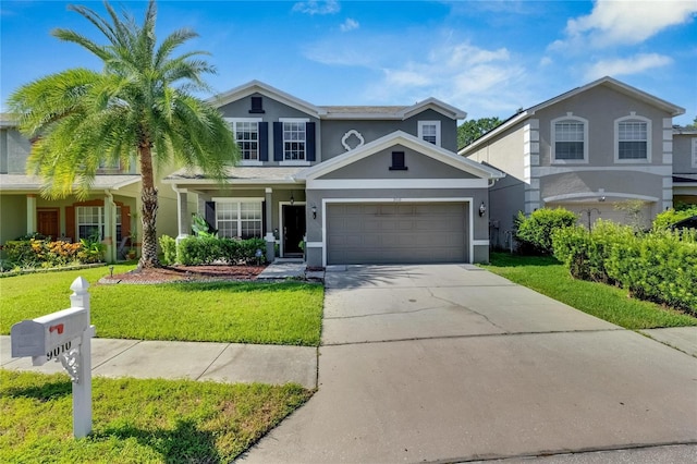 traditional home with driveway, a front lawn, and stucco siding