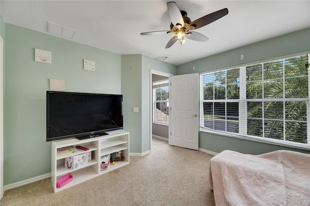 bedroom featuring light colored carpet, visible vents, ceiling fan, and baseboards