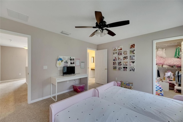 bedroom featuring light carpet, baseboards, visible vents, ceiling fan, and a closet