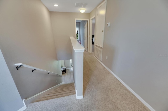 stairway featuring carpet floors, recessed lighting, visible vents, and baseboards