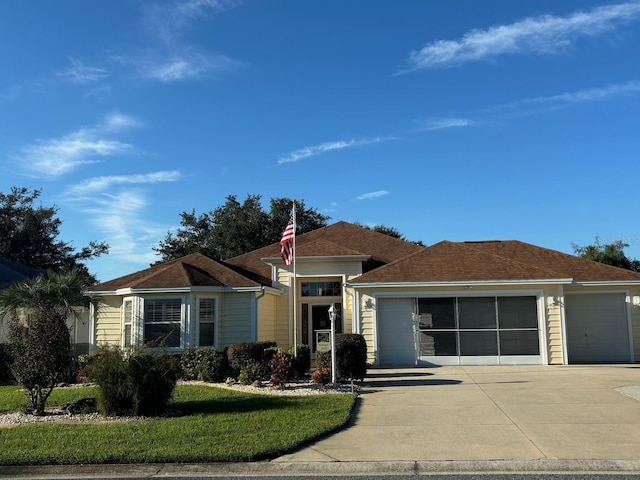 view of front of house featuring driveway and a garage