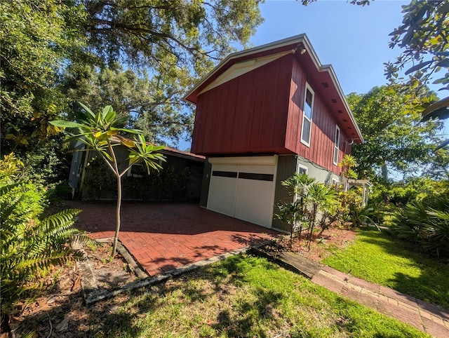 view of side of home with a lawn