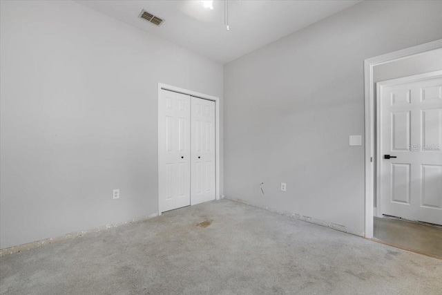 3616 Cypress Meadows Rd, Tampa, FL 33624 - unfurnished bedroom featuring a closet and carpet flooring