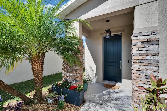 property entrance featuring stucco siding