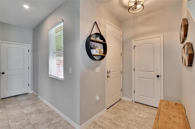 entrance foyer featuring baseboards