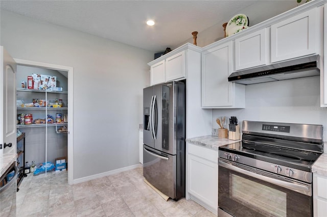 kitchen with white cabinets, under cabinet range hood, appliances with stainless steel finishes, and light countertops