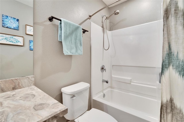 bathroom featuring shower / bath combo, vanity, and toilet