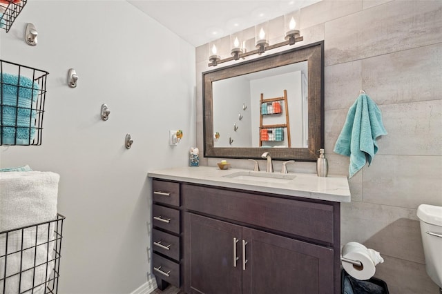 690 Island Way Unit 1003, Clearwater Beach, FL 33767 - bathroom featuring vanity, toilet, and baseboards