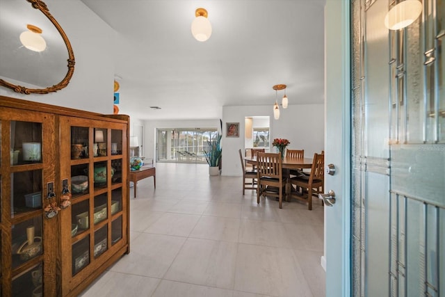 dining area with light tile patterned floors