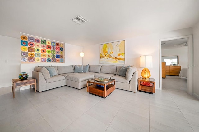 living area with visible vents and baseboards