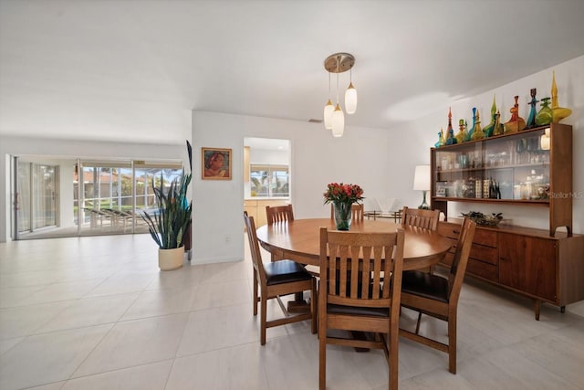 dining room featuring light tile patterned flooring