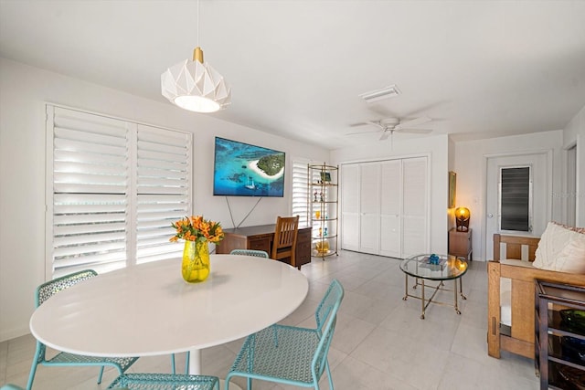 dining room with visible vents and a ceiling fan